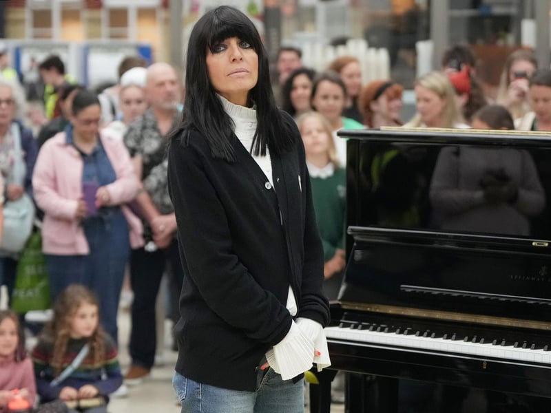 Claudia Winkleman has been pictured at Brighton railway station as her search continues to find more of the UK's most exciting amateur pianists.