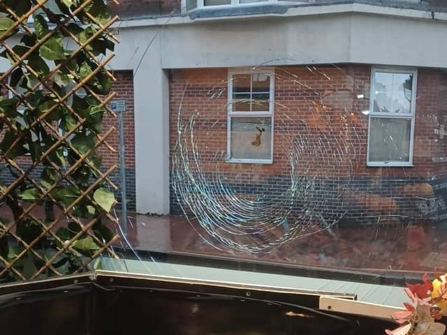 Sussex Police confirmed that the window of Dem Food Centre on Grove Road had suffered criminal damage after two men were seen smashing the window with a steel bin lid. Picture: Furkan Yilmaz