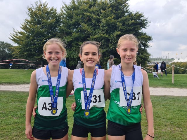 The under 13 winning Chichester girls team with their gold medals
