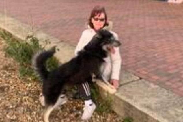 Police in Eastbourne are looking to identify this woman after her dog was reported to be out of control on the seafront.