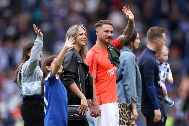 Alexis Mac Allister applauds the fans with family after Brighton beat Southampton 3-1 to secure European football for next season (Photo by Richard Heathcote/Getty Images)