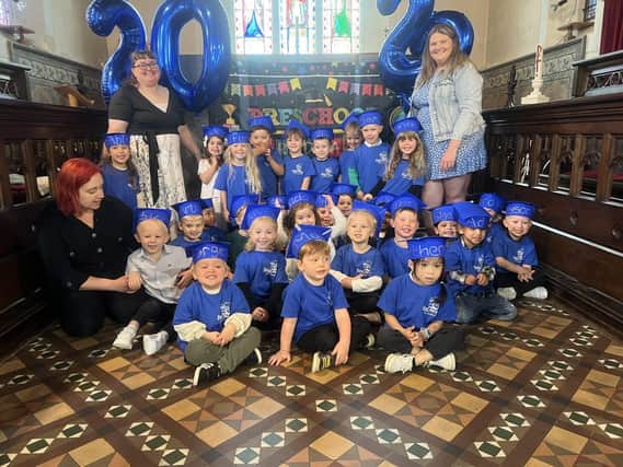 Class photo of the preschool children with their teachers. Photo: Discovery Day Nursery