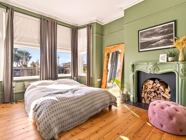 The front room is currently used as the master bedroom