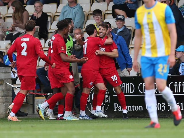 Action from Worthing's 3-0 win at Torquay United which put them top of National League South