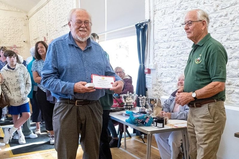 David Stubbings is presented with the RHS Banksian Medal for most prize money in vegetables, fruit and flowers. He also won the Silver Challenge Bowl for flowers, Ray Brown Memorial Shield for sweet peas, and Howard Challenge Cup for gentleman winning most points overall