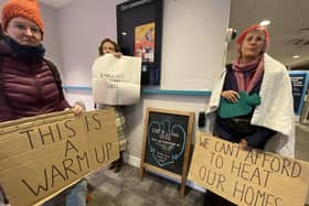 Protesters stage a Warm Up action inside Barclays Bank in Hastings