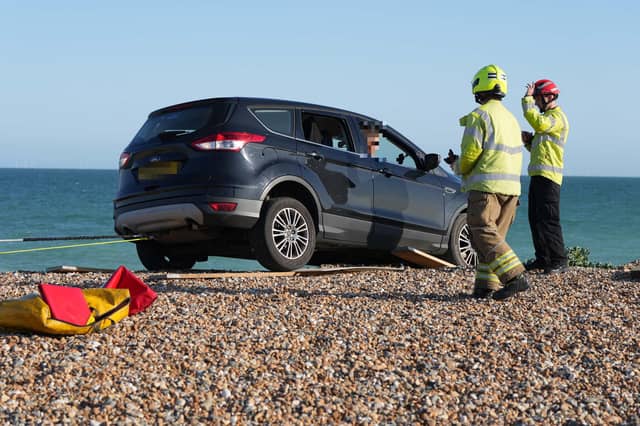 Police and the fire service helping at car on Worthing Beach on Monday evening, June 2