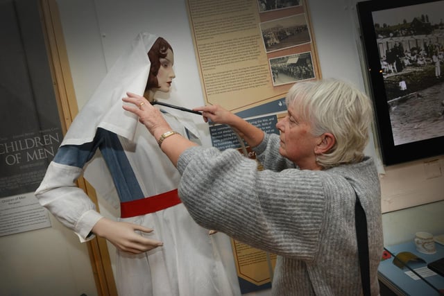 Bexhill Museum is getting ready to reopen on January 23 after its annual three-week closure. A model of a nurse gets a vacuum and brush-up from Penny Murray.