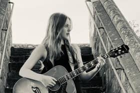 Lana Lanigan, from Chichester, plays original and cover songs on an acoustic guitar at just 13-years-old. For the last year, she has been attending sessions at ‘START ME UP!’, an open-mic venue in Southgate. Photo: Lana Lanigan.