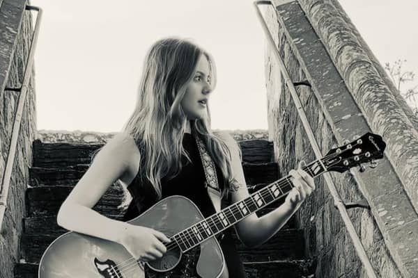 Lana Lanigan, from Chichester, plays original and cover songs on an acoustic guitar at just 13-years-old. For the last year, she has been attending sessions at ‘START ME UP!’, an open-mic venue in Southgate. Photo: Lana Lanigan.