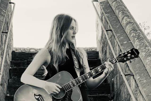 Lana Lanigan, from Chichester, plays original and cover songs on an acoustic guitar at just 13-years-old. For the last year, she has been attending sessions at ‘START ME UP!’, an open-mic venue in Southgate. Photo: Lana Lanigan.