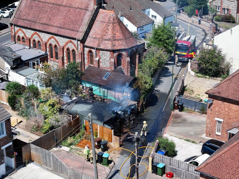 Firefighters tackle a blaze that destroyed two sheds, on Beaconsfield Road