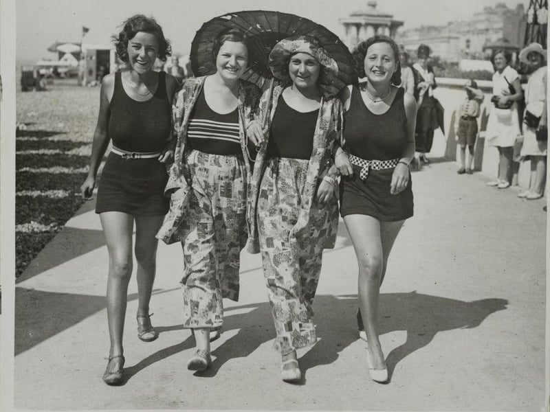 Beachgoers enjoy fresh air and sunshine in Brighton.