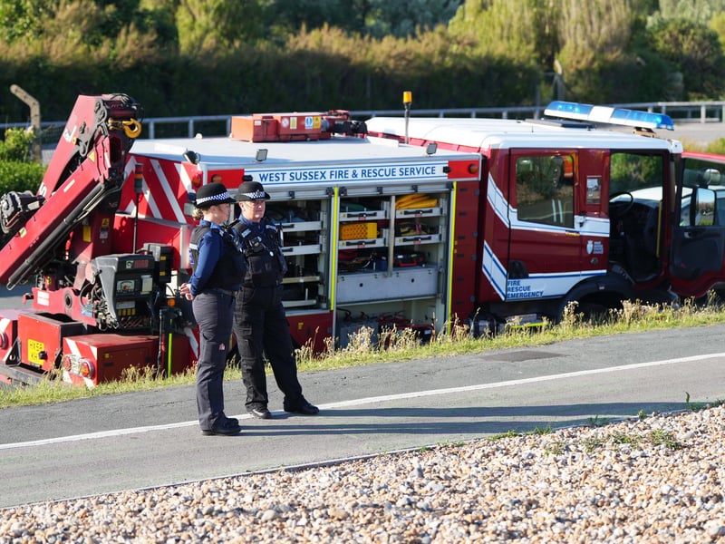 Police and the fire service helping at car on Worthing Beach on Monday evening, June 2