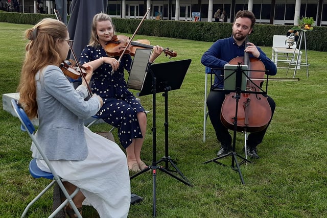 Musicians Hannah Teasdale, Kieran Carter and Gosia Zwierzchowska played some beautiful classical music to entertain guests