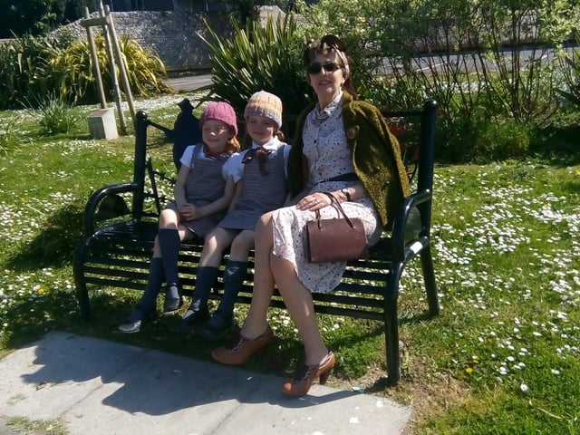 Gina Penn with twins Sasha and Scarlet on the memorial bench in Church Street, Littlehampton