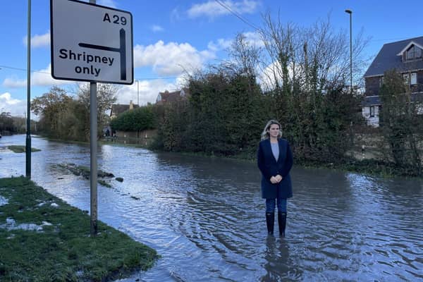 Jess Brown-Fuller standing in flooded road in Bersted 