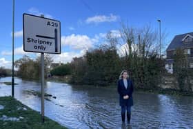 Jess Brown-Fuller standing in flooded road in Bersted 