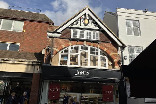 A gable above the Jones The Bootmaker shoe shop in West Street, Horsham, is an example of  “where the frontage is properly maintained and the detail of the plasterwork is carefully picked out.”