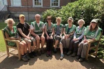 Volunteer members of the Friends of Horsham Park try out the new bench