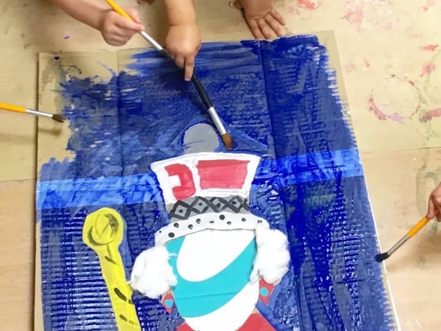 The children dressed as Kings and Queens for the day, and used their fingers to paint flags and the Queen