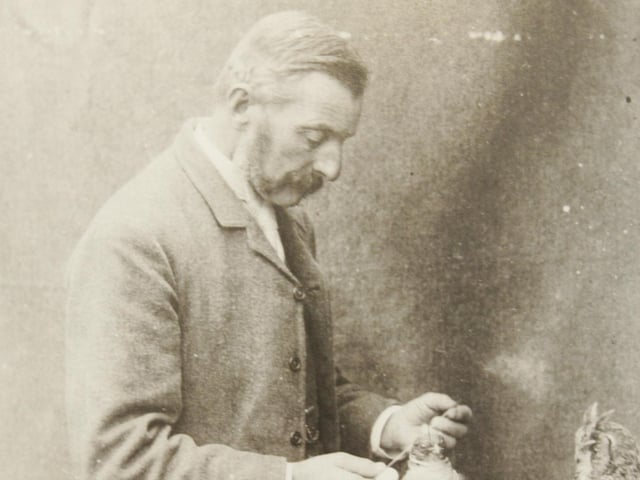 Taxidermist Walter Potter at work