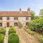 This landmark Grade II listed farmhouse with formal gardens and a swimming pool has come on the market in Worthing. Picture: Zoopla