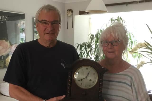 Paul Janes pictured with wife Annette with the clock. Picture from Sussex Police