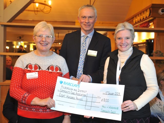 Pulborough and District Community Care Association with judge Gary Shipton, receiving £800 for the start-up costs of a new scheme to teach basic cooking skills