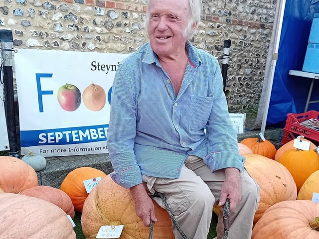 Derek Crush, who was crowned Champion Pumpkin Grower for 2023, sitting on his mighty beast weighing 49 kilos