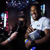 Anthony Joshua reacts as he is interviewed after a press conference ahead of his upcoming Heavyweight fight against Robert Helenius