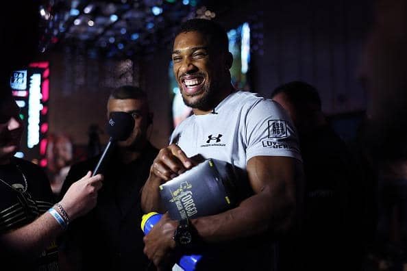 Anthony Joshua reacts as he is interviewed after a press conference ahead of his upcoming Heavyweight fight against Robert Helenius