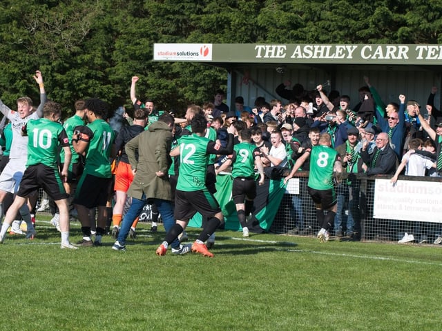 Burgess Hill Town players, fans and staff celebrate surviving in the Isthmian south east division at the end of their 0-0 draw with Beckenham