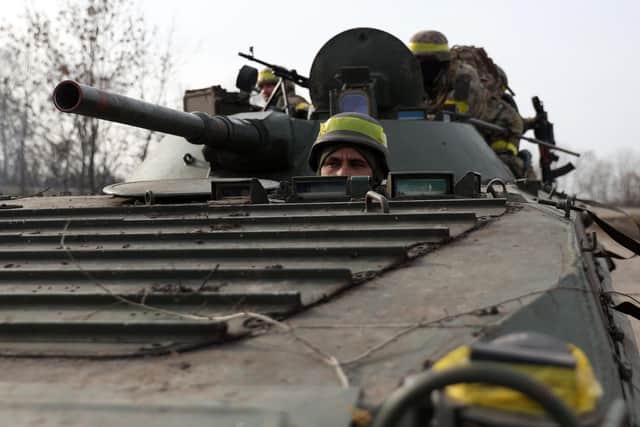 Ukrainian servicemen ride an infantry fighting vehicle towards a frontline in eastern Ukraine on November 24, 2022, amid the Russian invasion of Ukraine. (Photo by ANATOLII STEPANOV/AFP via Getty Images)