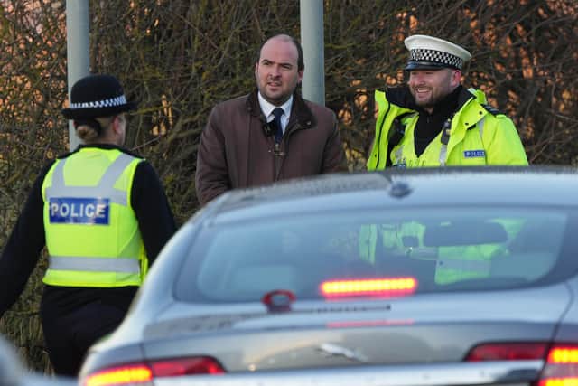Roads Minister Richard Holden chatting with officers from Sussex Roads Policing Unit. Picture by Eddie Mitchell