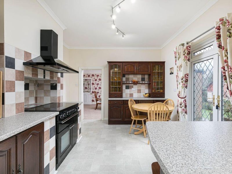 The kitchen/breakfast room is split into two areas, both of which offering a range of wall and base units with work surfaces over, space and plumbing for all white goods and a Rangemaster style oven with extractor hood above, space for a breakfast table and chairs with French doors to the garden.Photo: Supplied