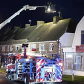 A person was taken to hospital after a Chinese takeaway restaurant caught fire in West Sussex.