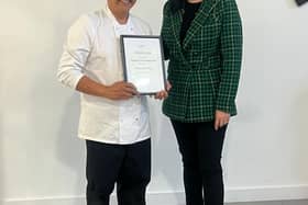 Rey receiving certificate