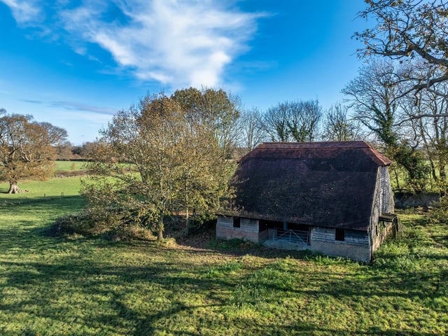 The small barn is on the east of the land