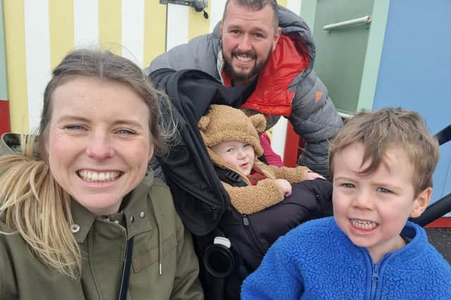 Parents Steph Roberts and James Oakley with their sons Max and Casper on Brighton Beach in December