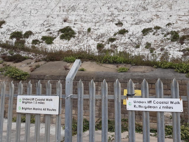 There is a pair of signs which show the point 1.5 miles from Brighton and 2 miles from Rottingdean