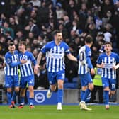 Jack Hinshelwood celebrates scoring his team's second goal with teammate Pascal Gross as Brighton hammer Crystal Palace (Photo by Mike Hewitt/Getty Images)