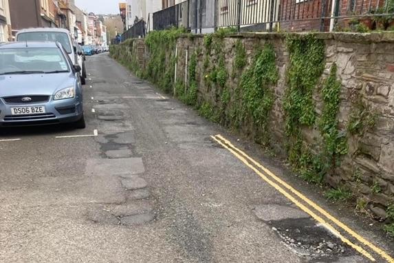 The poor state of the road surface in All Saints Street
