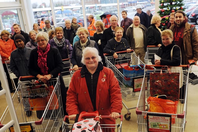 First in the queue, Linda Earl leads the way into Sainsbury's as it opens to customers