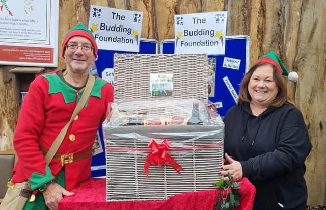 Sandra Whiffen from Worthing receiving her hamper from Budding Foundation founder, Clive Gravett