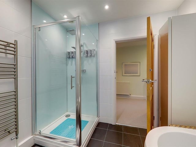 This impressive three-bedroom house close to the beach in Goring has a feature family room with part-vaulted ceiling