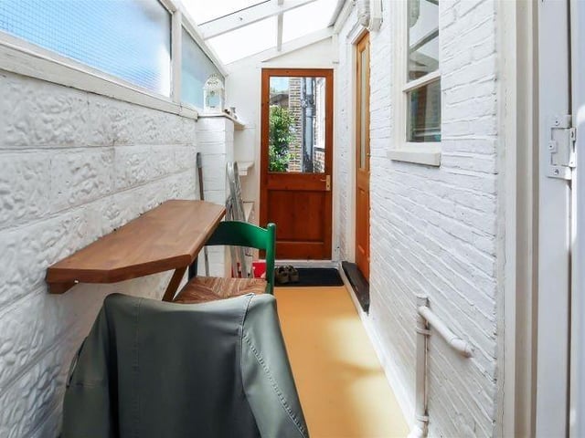 A lean-to area adjacent to the kitchen gives access to the ground-floor cloakroom