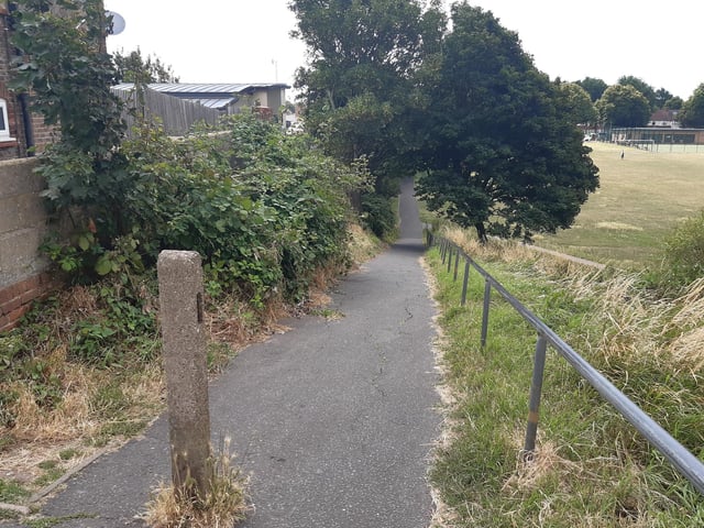 Follow the path down the eastern side of the field to Portslade Bowls Club