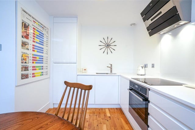 The apartment has an open-plan kitchen, dining and living space.