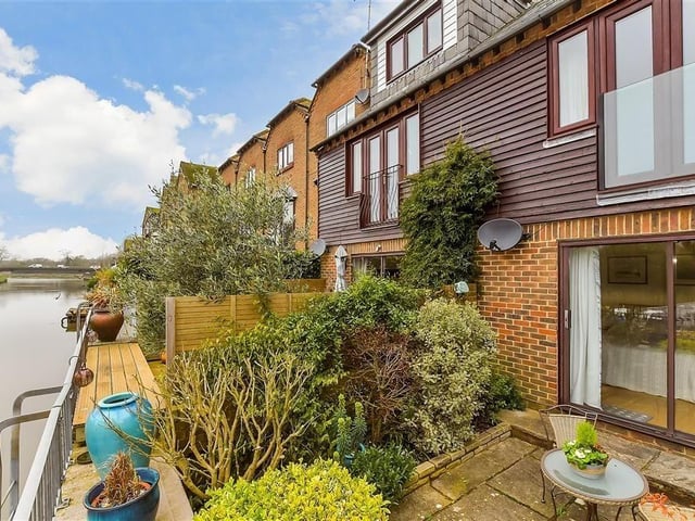 This modern town house with waterside garden is tucked away on a desirable private development in the heart of Arundel. It comes to the market with Cubitt & West, priced at £700,000.